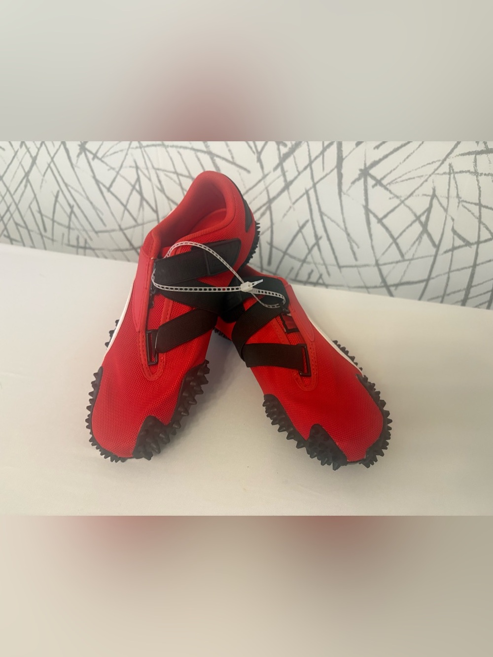 PUMA Mostro OG Sneakers. Vibrant  Red with a Unique Spike Sole.